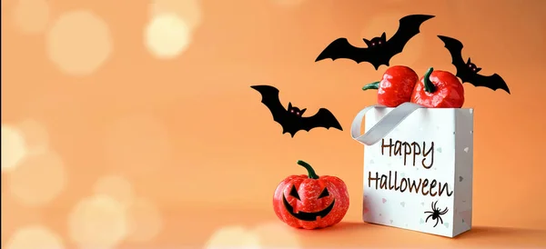 Halloween pumpkins, bats and shopping bag. Happy halloween concept.