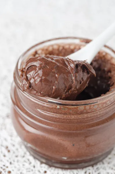 Chocolate paste in a glass jar closeup — Free Stock Photo