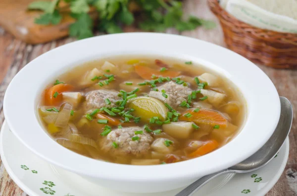 Plate of vegetable soup with meatballs — Stock Photo, Image