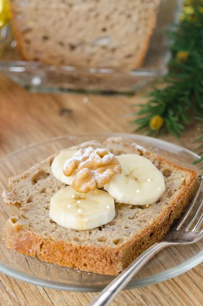 Slice of Christmas cake with banana and walnut — Stock Photo, Image