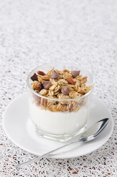 Yogurt and granola in a small glass beaker portions Royalty Free Stock Photos