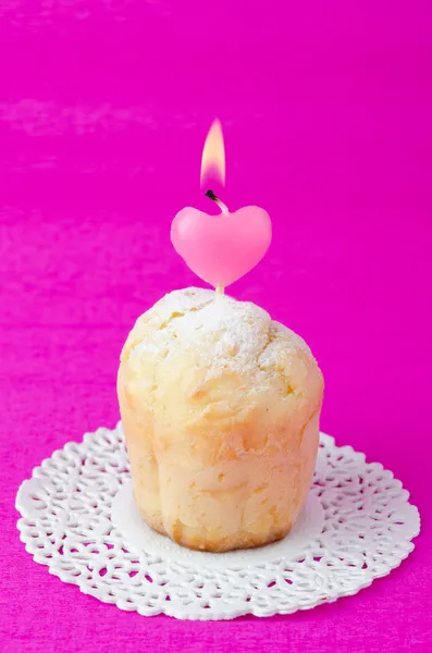 Rum Baba decorated with a lighted candle in the form of heart — Stock Photo, Image