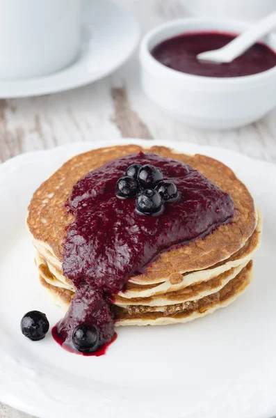 Stack of pancakes with black currant jam — Stock Photo, Image