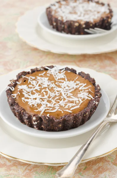 Chocolate tarts with cream and coffee closeup — Stock Photo, Image