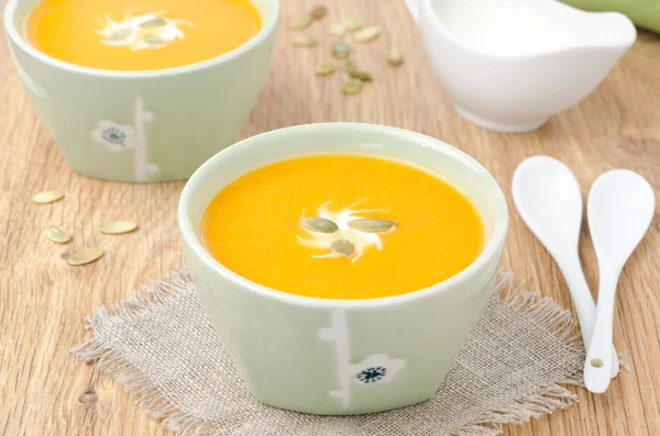 Two bowls of pumpkin soup with ginger horizontal — Stock Photo, Image