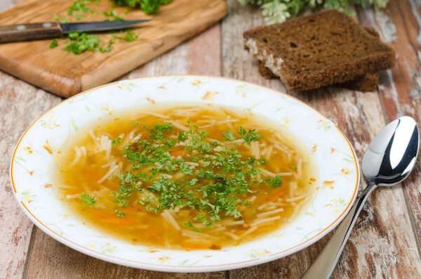 Chicken soup with noodles and carrots — Stock Photo, Image