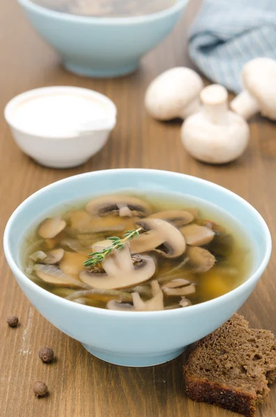 Mushroom soup in blue bowl vertical — Stock Photo, Image