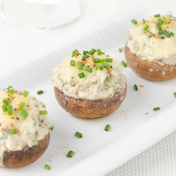 Stuffed mushrooms, baked with cheese and herbs, selective focus — Stock Photo, Image