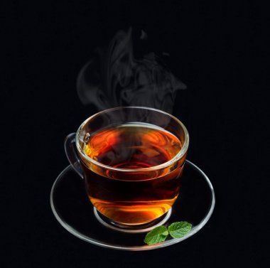 cup of black tea with mint and smoke on a black background clipart