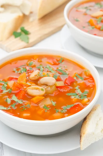 Vegetable soup with white beans in a bowl closeup vertical — Stock Photo, Image