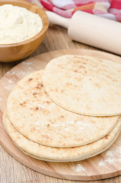 Wheat tortillas on a wooden board — Stock Photo, Image
