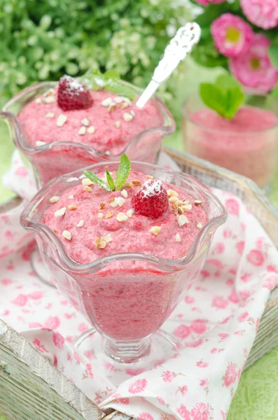 Raspberry mousse decorated with mint and fresh raspberries — Stock Photo, Image