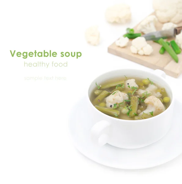 Vegetable soup with cauliflower and green beans closeup isolated — Stock Photo, Image