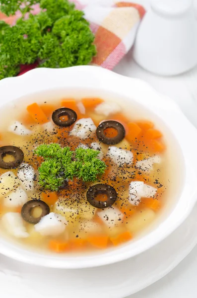 Fish soup with potatoes, carrots and olives vertical — Stock Photo, Image