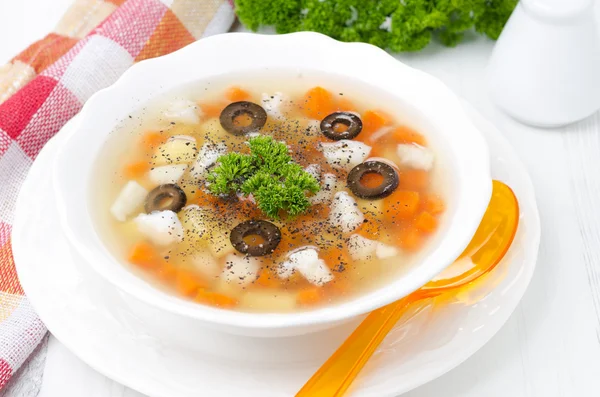Fish soup with potatoes, carrots and olives — Stock Photo, Image