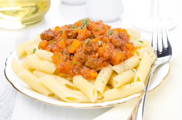 Penne pasta with sauce of beef, tomato and pumpkin — Stock Photo, Image