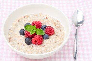 healthy breakfast - oatmeal with fresh berries, top view