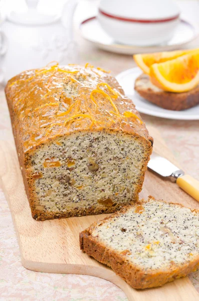 Orange cake with poppy seeds, dried apricots and walnuts — Stock Photo, Image