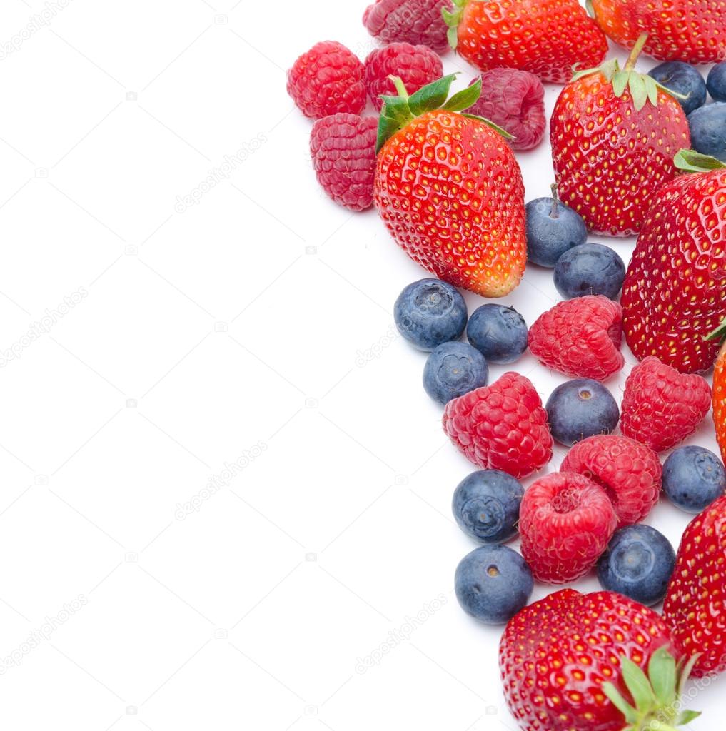 Assorted fresh berries isolated on a white background