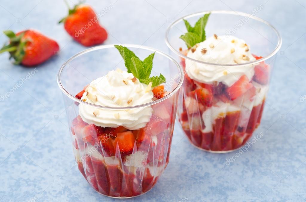 Dessert with cookies, berry puree, strawberries, whipped cream — Stock