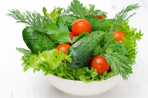 Bowl with fresh vegetables and herbs for salad horizontal — Stock Photo, Image