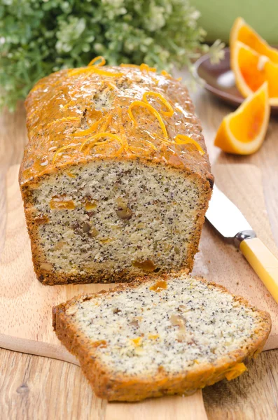 Orange cake with poppy seeds, dried apricots and walnuts — Stock Photo, Image
