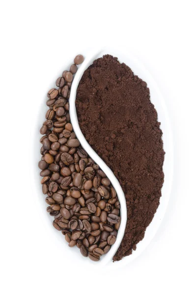 Coffee beans and ground coffee in a white plate — Stock Photo, Image