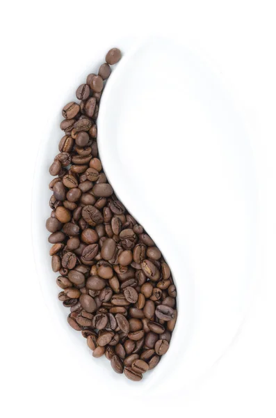 Plate in the form of grain half-filled with coffee beans — Stock Photo, Image