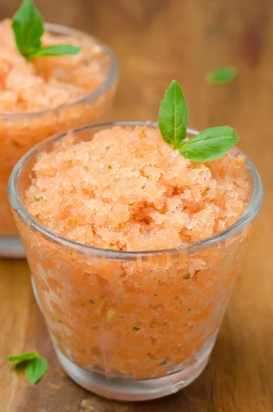Tomato sorbet with basil in a glass vertical close-up — Stock Photo, Image