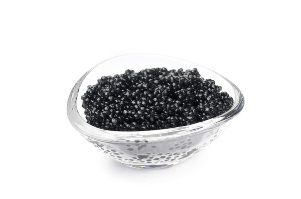 black caviar in a glass bowl isolated on a white background