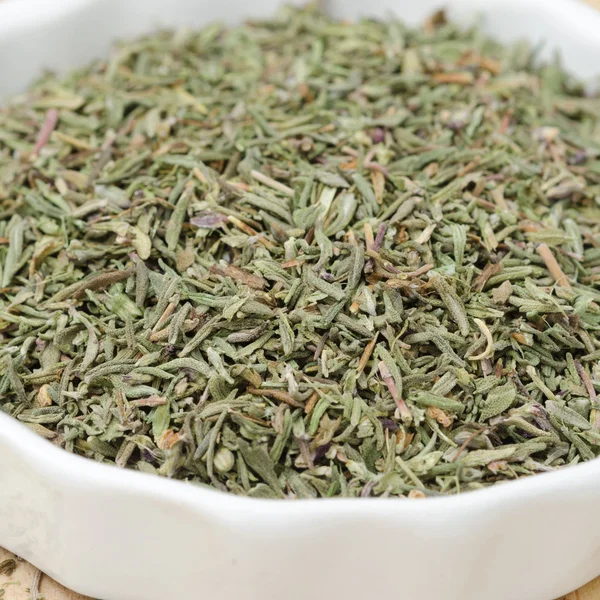 Dried thyme in a white bowl — Stock Photo, Image