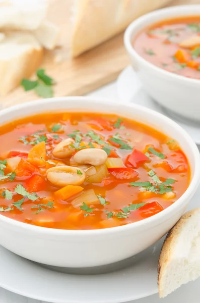 Vegetable soup with white beans in a bowl closeup — Stock Photo, Image