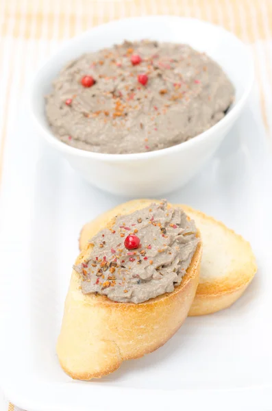 Liver pate with pink pepper on toasted bread — Stock Photo, Image
