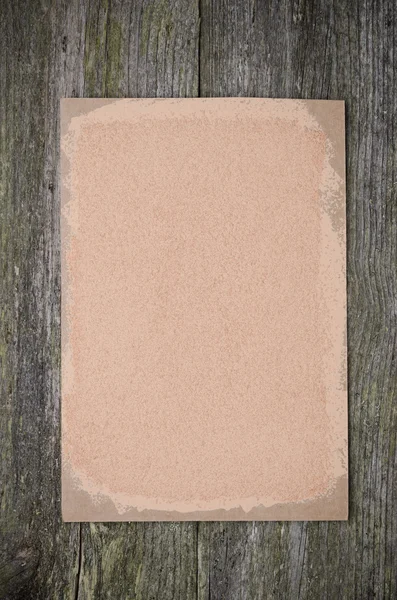 Empty sheet of paper is cream colored for recipe on the old wood — Stock Photo, Image