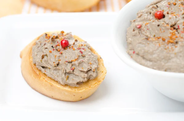 Toast with liver pate with pink pepper — Stock Photo, Image