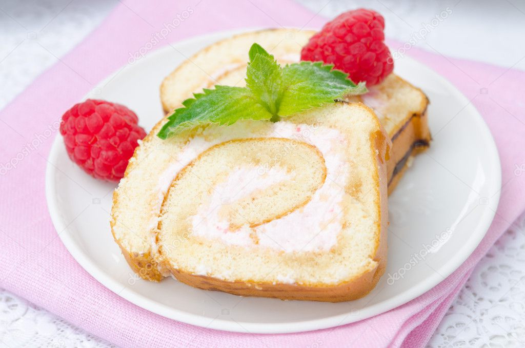 piece of swiss roll with raspberry cream