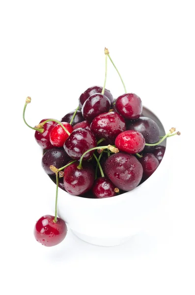 Bowl of fresh cherries on a white background, vertical — Stock Photo, Image