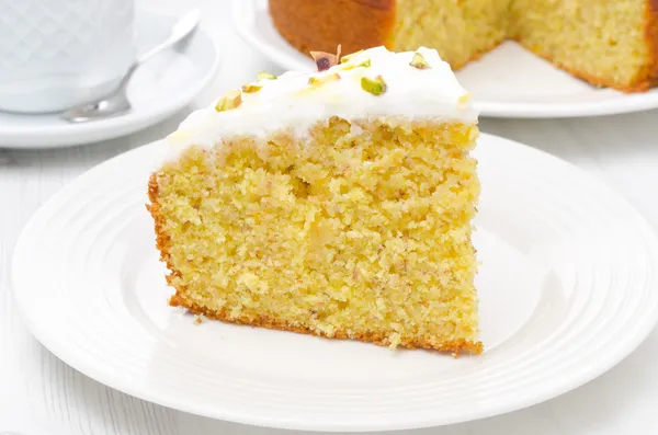 Piece of orange cake with Greek yogurt, honey and pistachios — Stock Photo, Image