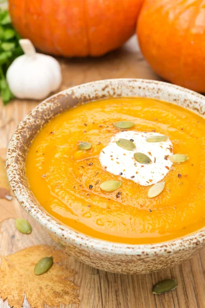Pumpkin soup with coriander and cream in a bowl — Stock Photo, Image