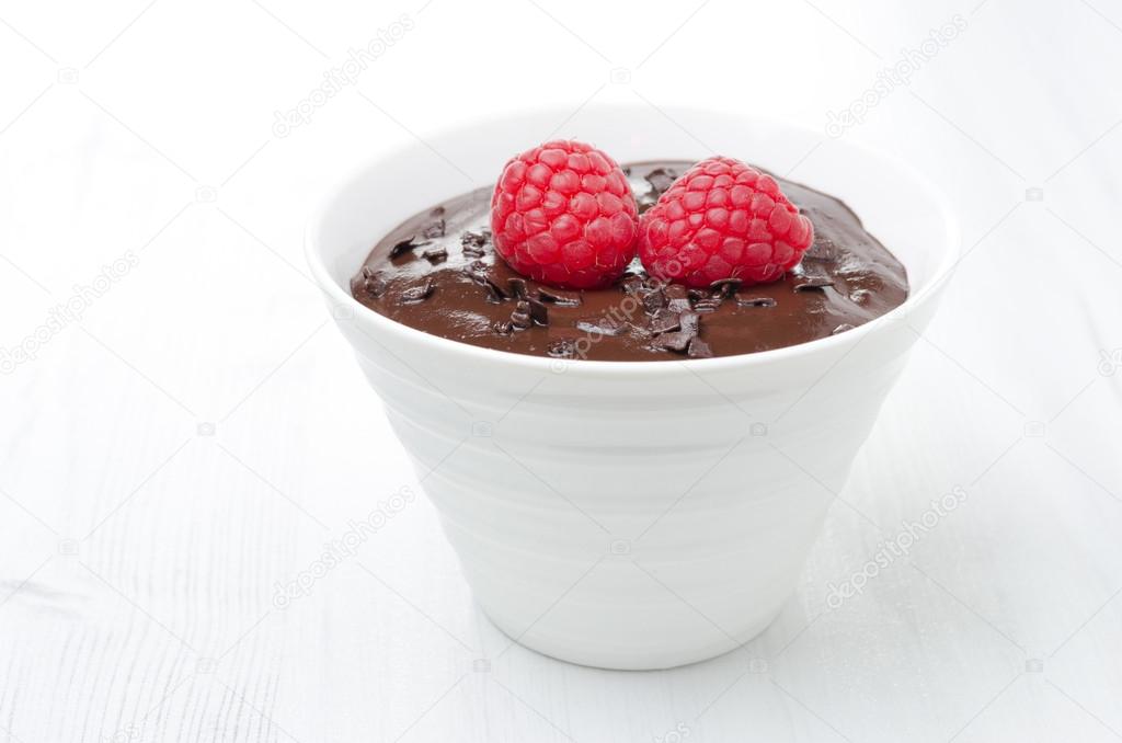 chocolate mousse with raspberries on a white background
