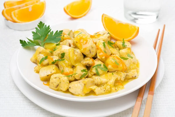 Chicken fillet with orange sauce and parsley on the plate — Stock Photo, Image