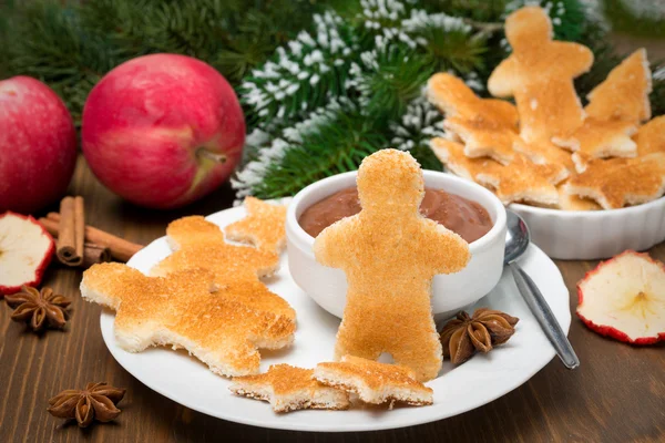 Christmas breakfast - toast in the shape of little men — Stock Photo, Image