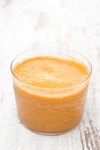 Glass of fresh squeezed peach juice — Stock Photo, Image