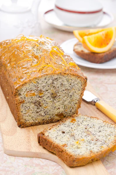 Orange cake with poppy seeds, dried apricots and walnuts — Stock Photo, Image