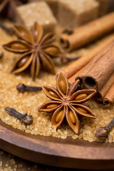 Spices and brown sugar for a Christmas baking in a wooden bowl — Stock Photo, Image