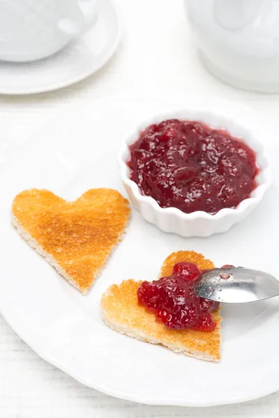 Toast in the shape of hearts and berry jam — Stock Photo, Image