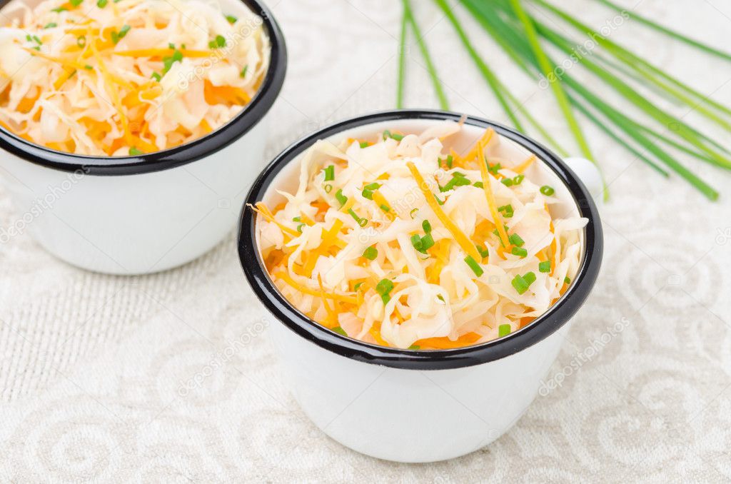 Salad of pickled cabbage with carrots and green onions