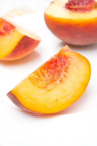 Slice of fresh peach on a plate — Stock Photo, Image