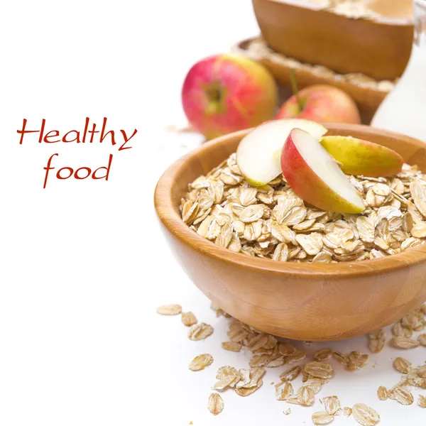 Desayuno saludable - copos de avena con manzanas en un tazón —  Fotos de Stock