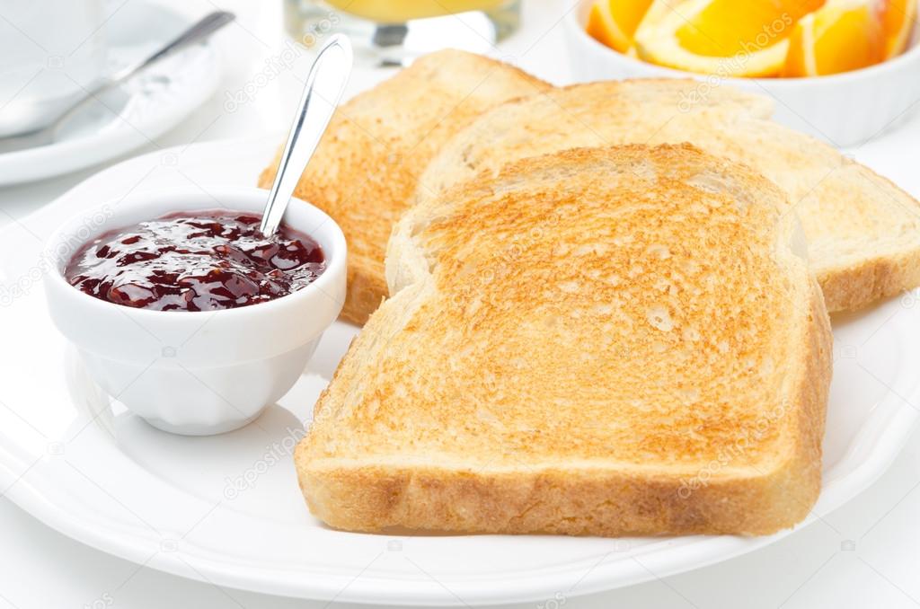 breakfast with toasts, jam, coffee and orange juice, horizontal